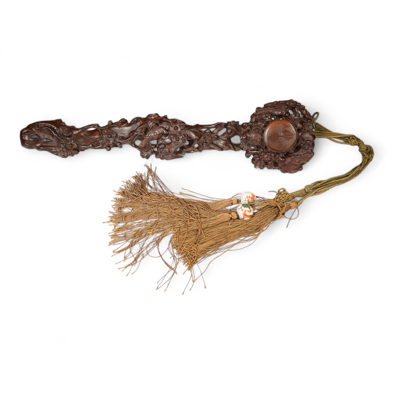 A Chinese carved hardwood Ruyi sceptre, with two porcelain ‘dragon’ beads, 50cm in length
